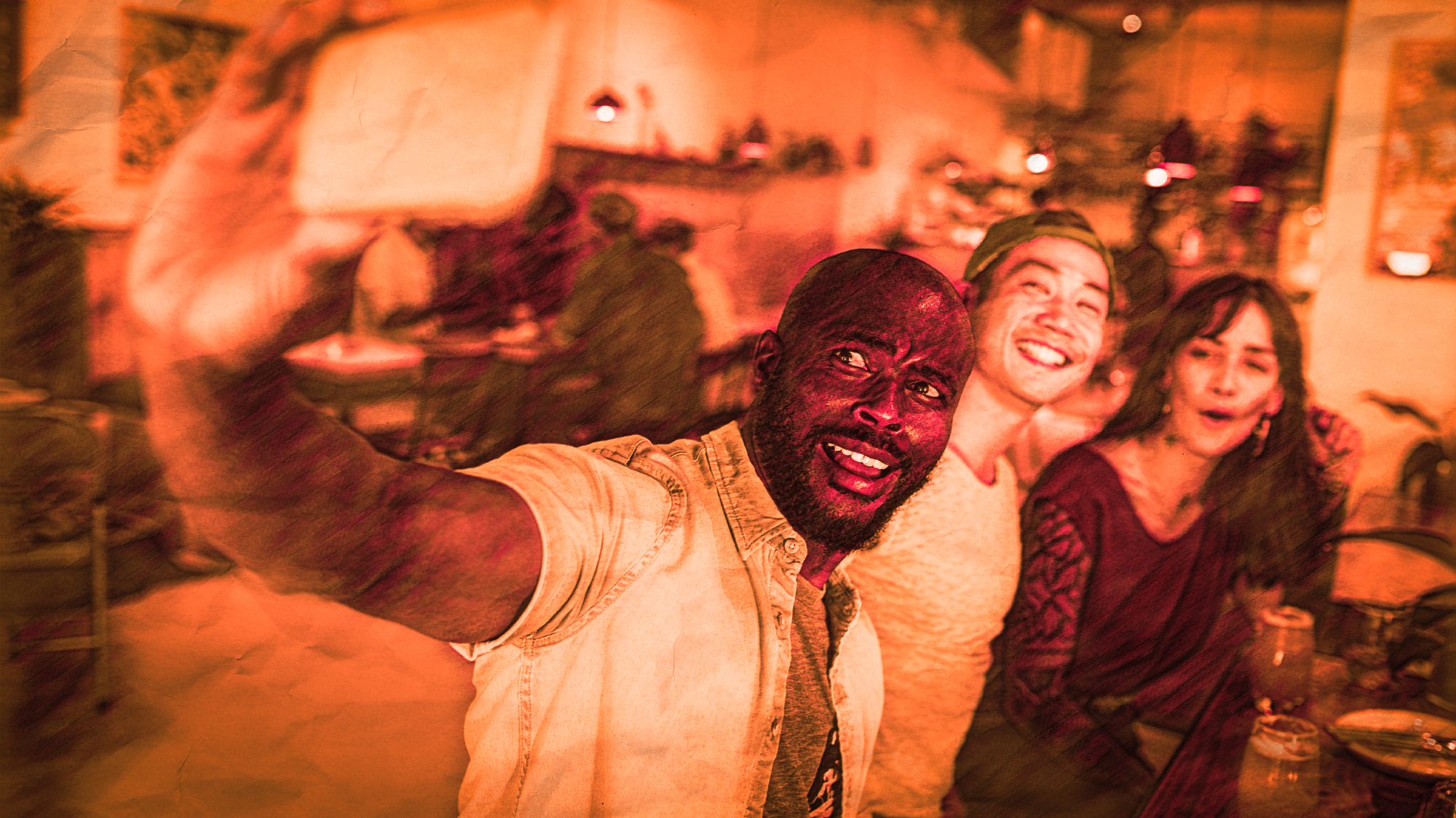 Smiling friends taking selfies together in a bar