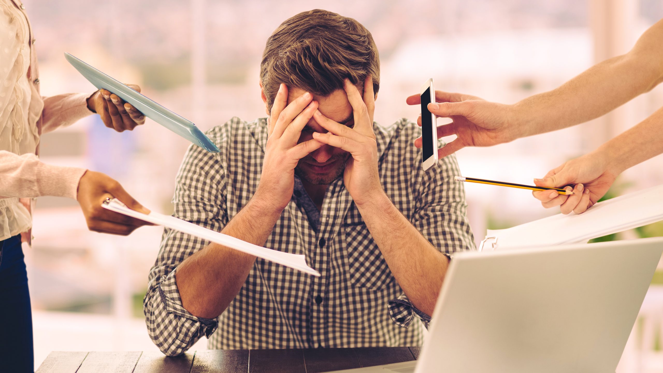 Stressed man frustrated with electronic devices
